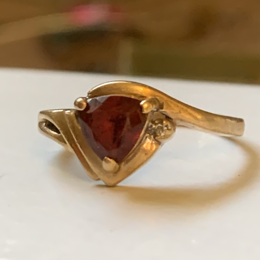 10k Solid Gold Love Story Ring Red Trillion cut Garnet & Diamond. Band bent some